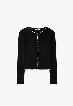 Čierny pletený cardigan s dlhými rukávmi, s vyšívaným bielym okrajom pozdĺž výstrihu a lemovania, s šiestimi prednými gombíkmi.