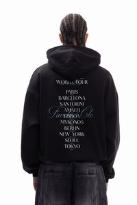 Black hoodie featuring a large graphic text on the back listing cities and countries, with "WORLD TOUR" at the top and "Favela Co." accented in blue.