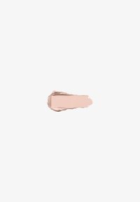 Échantillon de fond de teint beige avec une texture crémeuse sur un fond gris clair uni.