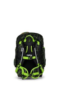 Ergobag backpack featuring a black and green geometric pattern, adjustable straps, buckles, and reflective accents for visibility.