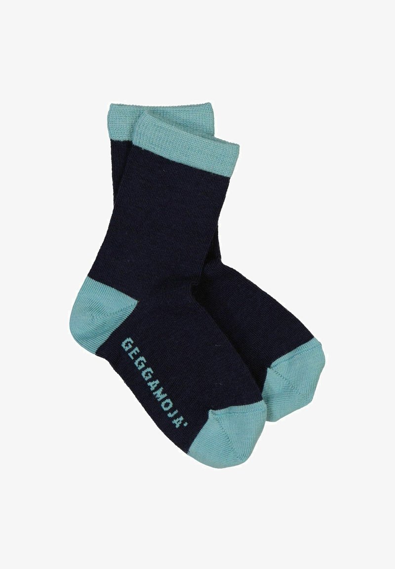 Marineblå strømper med lyse turkise manchetter og såler, der har en tekstureret overflade og et lille logo trykt på siden.