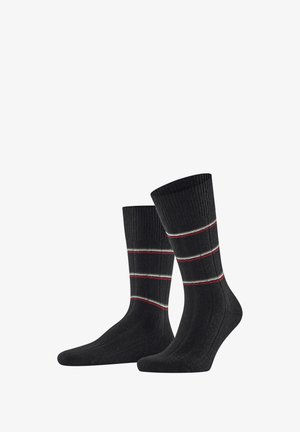 Calcetines negros con textura acanalada, que presentan tres franjas horizontales en rojo y blanco. Longitud estándar con refuerzo en el talón y la puntera.