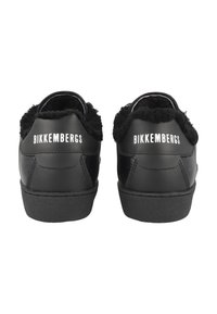 Black leather sneakers with a fluffy black collar, rubber soles, and "BIKKEMBERGS" logo in white on the heel. Smooth finish and rounded shape.