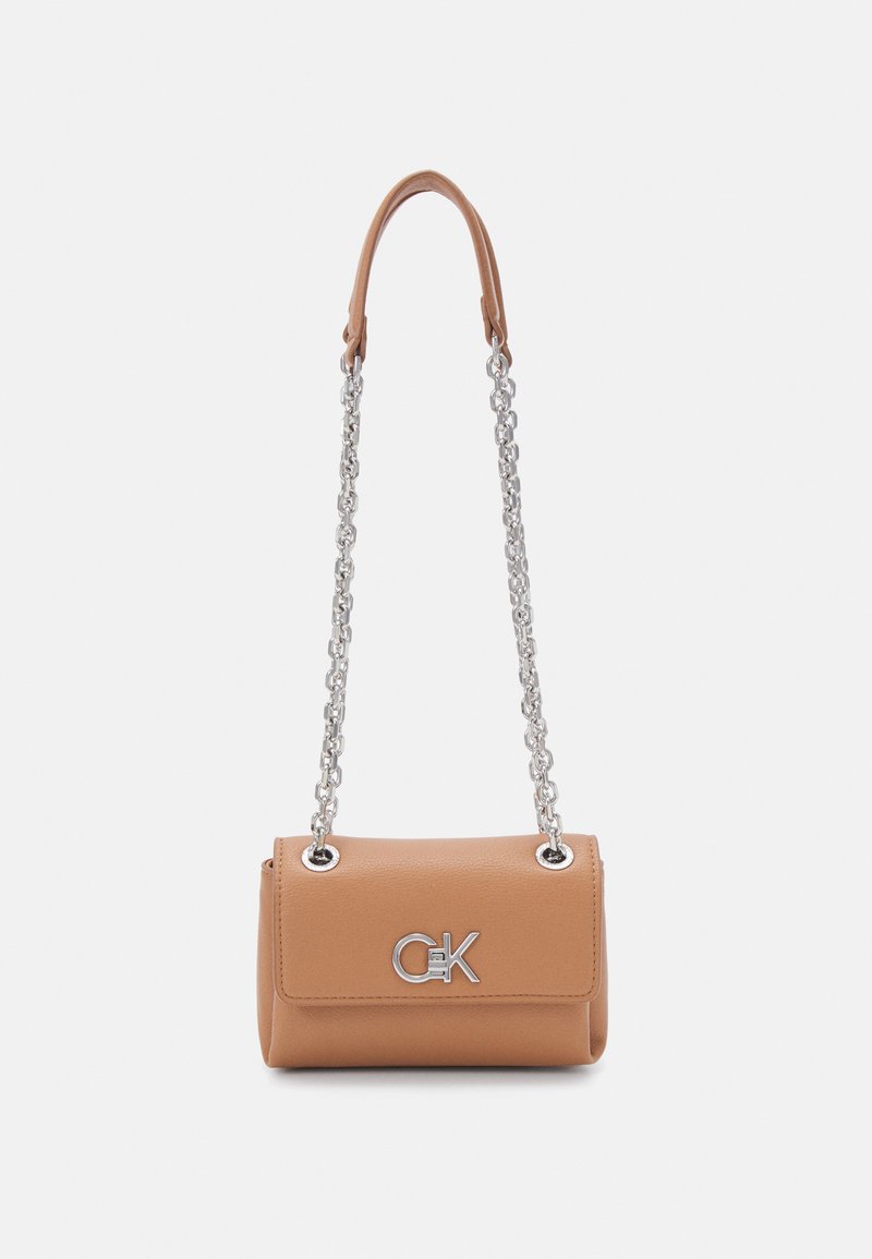 Calvin Klein RELOCK SHOULDER BAG - Borsa a mano - lion