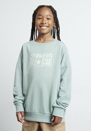 Felpa verde chiaro con collo rotondo e maniche lunghe, caratterizzata da una stampa bianca "Converse All Star" sul davanti. Tessuto texturizzato.