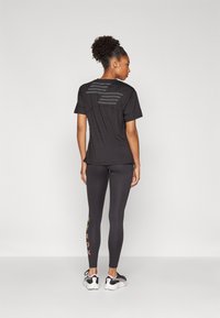 Puma HYROX CLOUDSPUN - Leggings - black