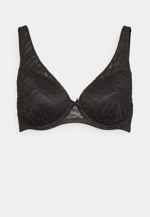 Bralette en dentelle noire avec une forme triangulaire, des bretelles réglables, un motif floral texturé et un accent en nœud au centre.