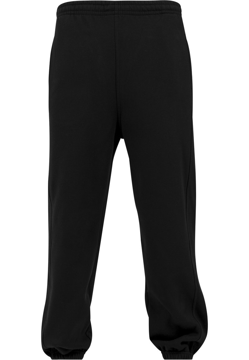 Svarta joggingsbyxor i ett mjukt, slätt tyg. Utrustade med resårmidja och resårer vid bensluten, samt sidofickor och rak passform.