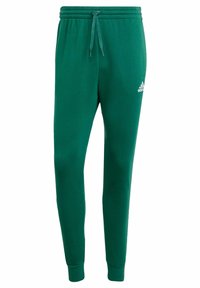 Green sweatpants made of soft fabric with an elastic waistband, drawstring, and cuffed ankles. Features a small white logo on the side.