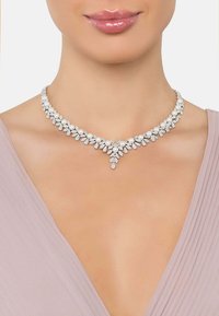 Pearl and crystal necklace featuring a leaf-like design with a central drop accent, set in a silver-tone metal. Smooth, shiny finish.