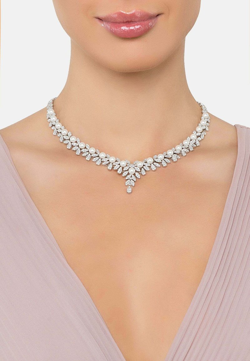 Pearl and crystal necklace featuring a leaf-like design with a central drop accent, set in a silver-tone metal. Smooth, shiny finish.