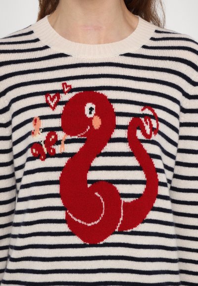 Striped knit sweater featuring a red snake graphic with eyes and heart accents, against a cream background with navy stripes.
