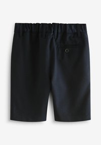 Navy shorts with elastic waistband, button detail at the back, and tailored design. Smooth fabric texture and knee-length fit.