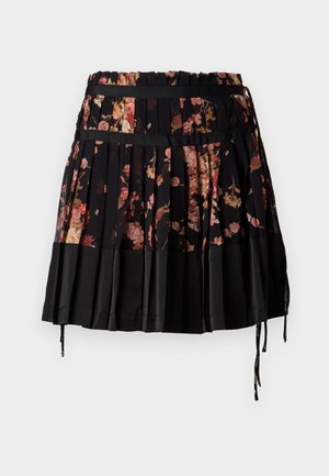 Falda plisada negra con diseño floral en tonos de rosa y naranja, con una cinturilla ancha y cordones ajustables en el dobladillo.