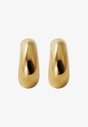 Zuecos metálicos dorados con una superficie lisa y brillante, punta redondeada y diseño ergonómico, que presentan una estética moderna y minimalista.