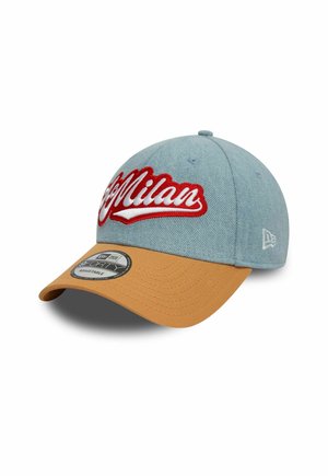 Blue denim cap with a structured top, embroidered "Milan" in red, and a tan visor. Features an adjustable strap and branded inner label.