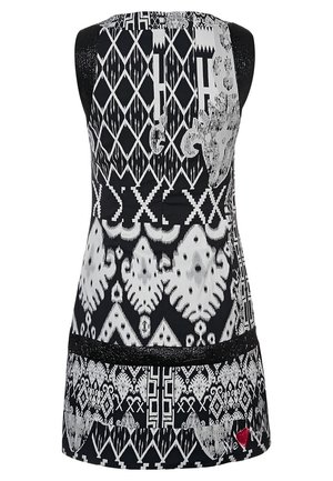 Tunique sans manches noir et blanc présentant des motifs géométriques complexes, un tissu lisse et une accent en dentelle à l'ourlet.