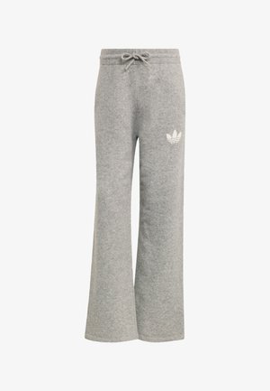 Pantalon de survêtement gris clair à jambes larges avec ceinture élastique et cordon de serrage, arborant un logo trefoil Adidas blanc sur la cuisse gauche.