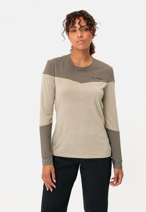 Lightweight, moisture-wicking long-sleeve shirt in beige with dark gray accents. Features a subtle pattern and logo on the chest.