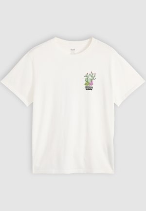 Hvid bomulds t-shirt med et kaktus- og blomsterdesign i grøn og pink samt et sort "Levi's" label ovenfor. Kortærmet og rund hals.
