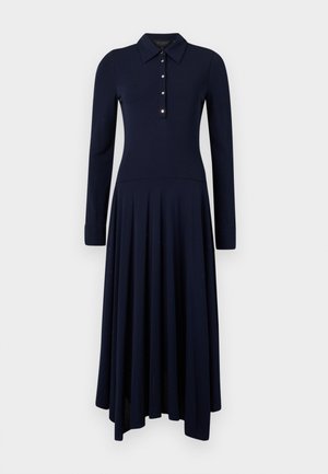 Abito lungo navy a maniche lunghe con colletto, placca con bottoni e gonna svasata. Realizzato in un tessuto stretch liscio di colore uniforme.