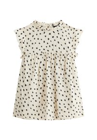 Cotton dress with short, ruffled sleeves, cream base and scattered black polka dots. Gathered waist creates a flared shape.