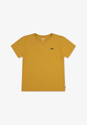 T-shirt à manches courtes jaune moutarde avec col rond et petite étiquette noire du logo Levi's sur la poitrine gauche.