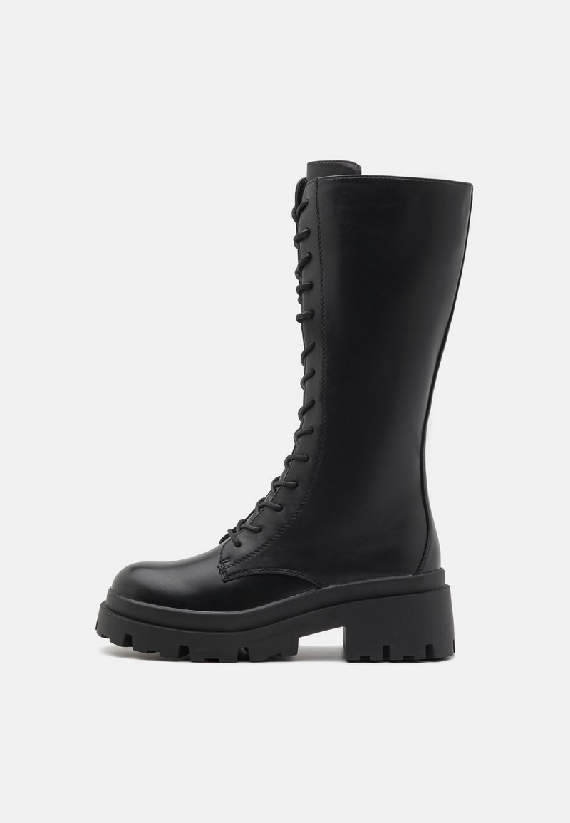 Black leather knee-high boots with a chunky sole. Features front lacing and a smooth texture, providing a sleek and sturdy design.