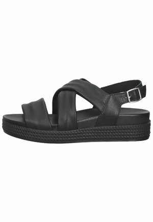 Sort læder sandal med krydsede frontstropper, justerbar bukkebælte ved hælen og tekstureret platformsål.