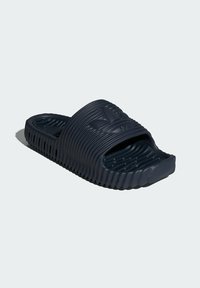 Navy blue rubber slide sandal with textured upper strap, grooved footbed, and ridged sole for enhanced grip and comfort.