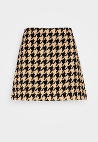 Sukně s kostkovaným vzorem v béžové a černé barvě, vyrobená z texturované tkaniny, s rozšířeným střihem a rovním lemem.