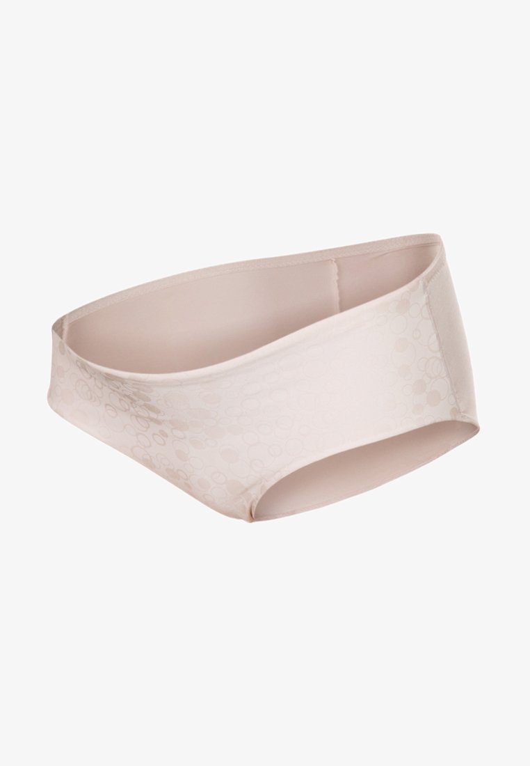 Nude-colored brief made of smooth fabric, featuring a subtle circular pattern, low-rise design, and medium coverage on the sides.