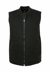 Chaleco sin mangas negro hecho de una mezcla de algodón, con cremallera frontal y dos bolsillos frontales. Diseño sencillo con cuello redondo.