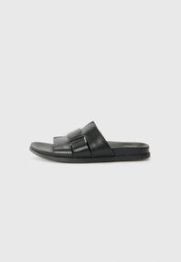 Black slip-on sandals with two wide straps featuring a glossy finish and rectangular accents. Smooth sole and simple, rounded design.