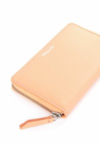 Peach-colored leather wallet with a textured surface, zip closure, and contrasting zipper pull. Features subtle branding in white.