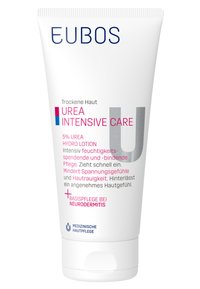 Urea Intensive Care lotion in a white tube with blue and pink accents. Contains 5% urea, labeled for dry skin, with clinical care notes.