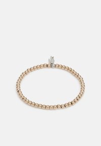 Bracelet perlé composé de petites sphères métalliques de couleur or. Agrémenté d'un pendentif en argent en forme d'oiseau.