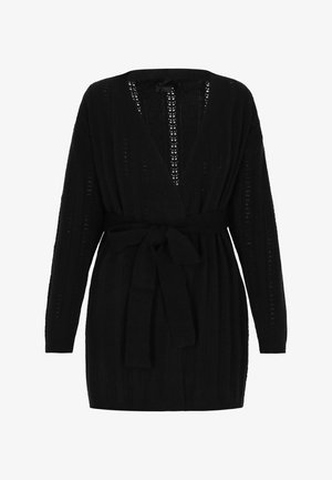 Black knitted cardigan with a deep V-neck, long sleeves, and a tie belt. Features vertical ribbed texture and open stitch details.