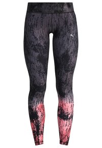 Czarno-szare legginsy w wzór z gradientem przechodzącym w róż na mankietach. Wykonane z elastycznego materiału, z dopasowanym krojem.