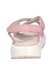 Sandalias de cuero rosa con strap trasero, diseño abierto, plantilla acolchada y tacón blanco de bloque para mayor comodidad y soporte.