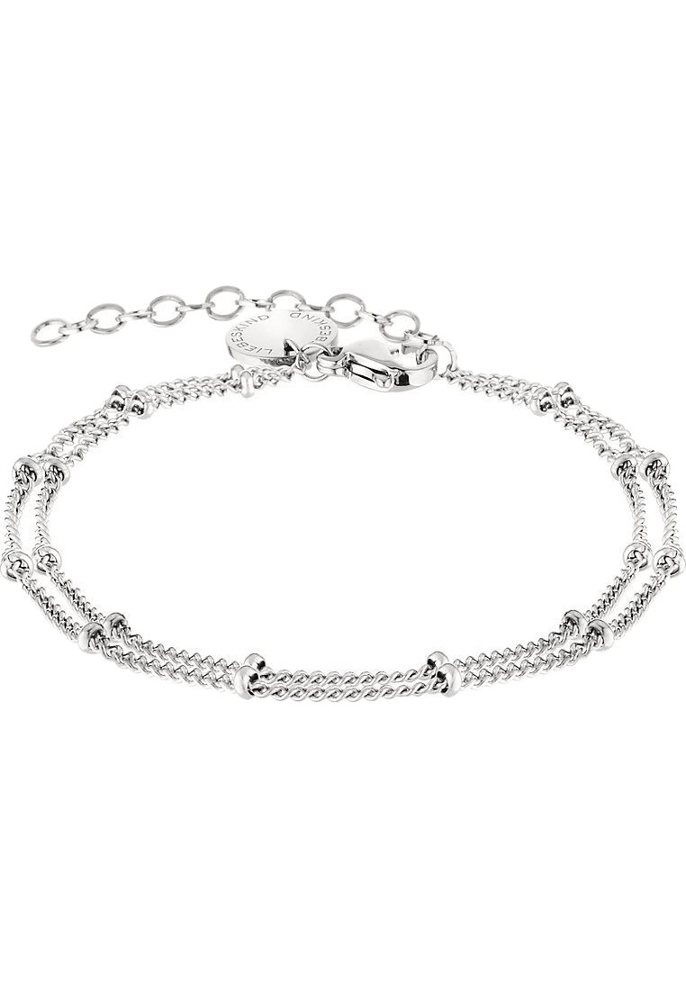 Bracciale in argento con tre fili di catena attorcigliata, accentuati da metallo liscio e chiusura a moschettone. Include una catena regolabile.