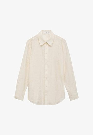 Cream button-up shirt with long sleeves, featuring a textured floral pattern, pointed collar, and a straight fit.