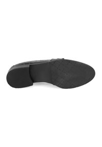 Black shoe sole made of rubber with a textured, patterned surface. Features a flat heel and a smooth, tapered front.