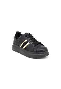 Black leather sneaker with thick sole, black laces, two beige stripes, and black textured stripe on the side, angled right on white background.