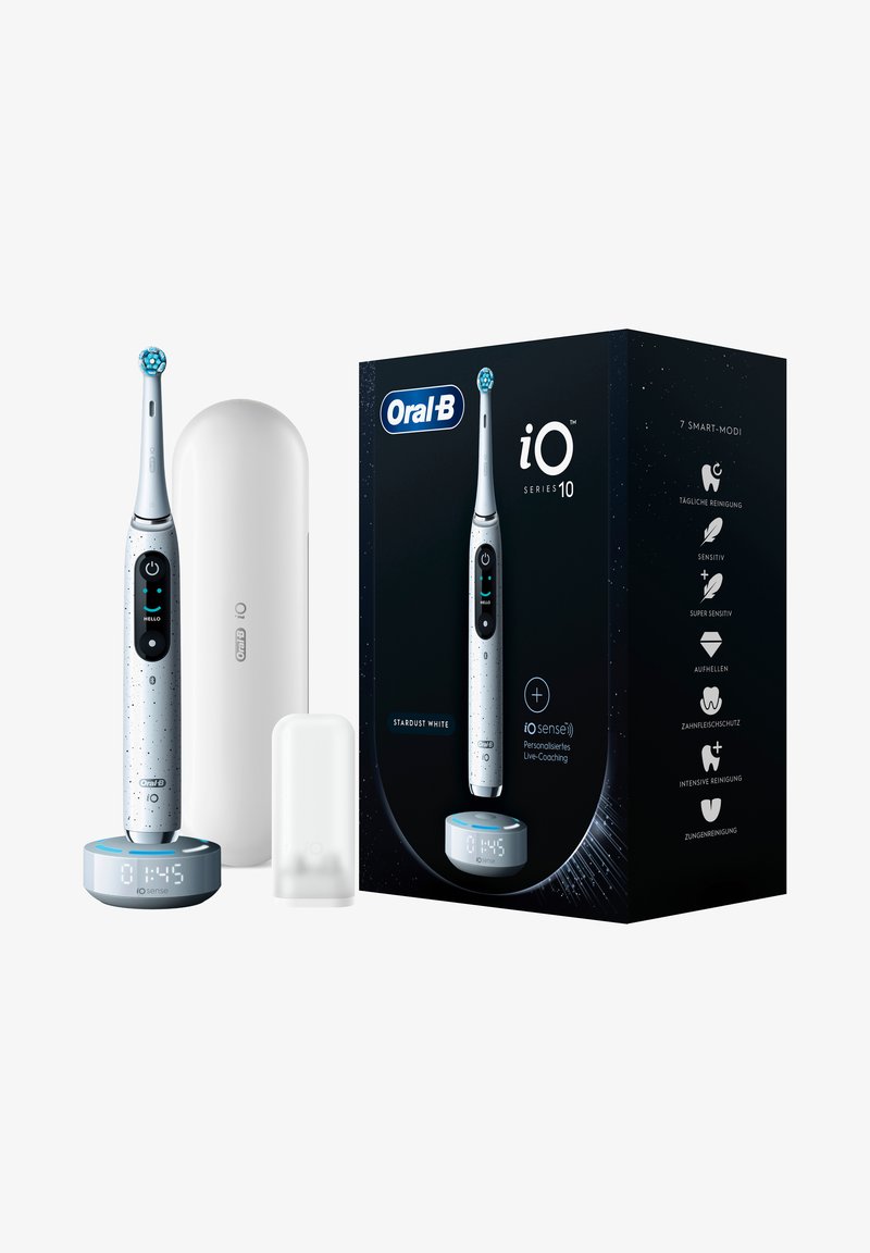 Electric toothbrush with a white and silver design, dotted texture, smart display base, protective case, and black packaging.