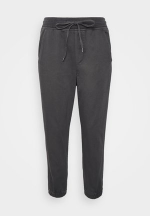 Grijze joggingbroek gemaakt van een zachte katoenmengeling, met een elastische tailleband en een trekkoord, zijzakken en taps toelopende boorden.