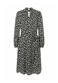 Robe à pois noir et blanc avec des manches longues, décolleté en forme de clé, taille cintrée et ceinture nouée à la taille. Texture de tissu douce.