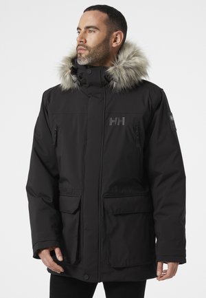 Black insulated jacket with a faux fur-lined hood, zippered pockets, and embossed logo. Features a structured design and durable fabric.