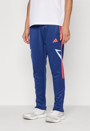 Pantalon de survêtement - dark blue glow blue semi lucid red