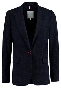 Blazer bleu marine à motif à petits pois rouges et blancs. Fermeture à un seul bouton, deux poches avant, revers crantés et étiquette intérieure de marque.